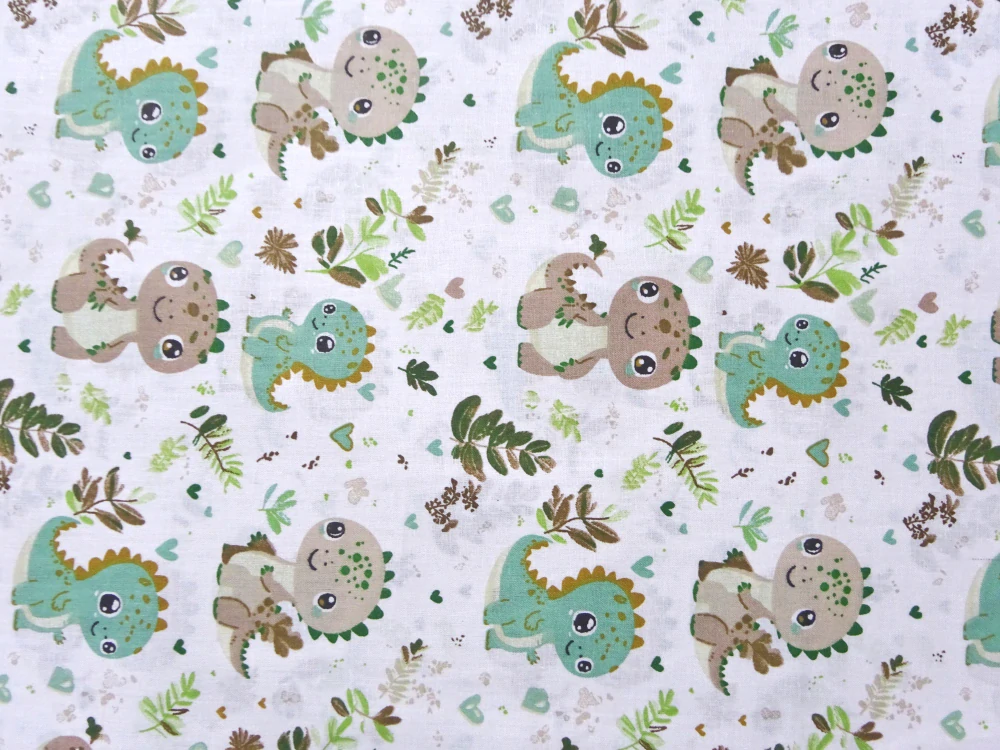 Bavlna biela "zelený a hnedý dinosaurus" 