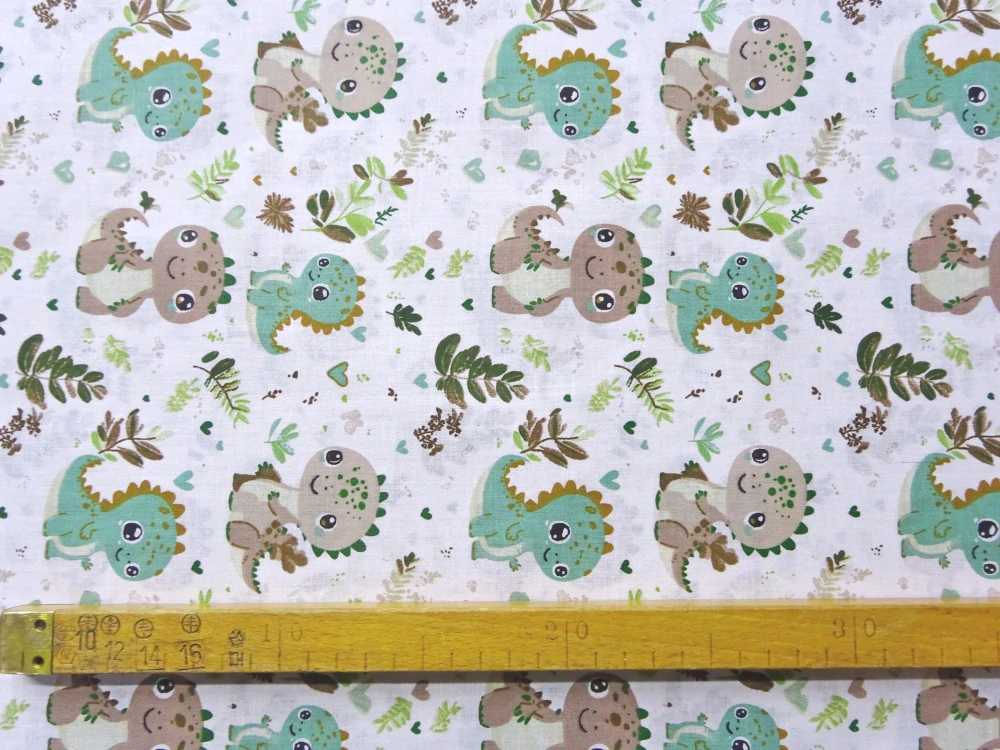 Bavlna biela "zelený a hnedý dinosaurus" 