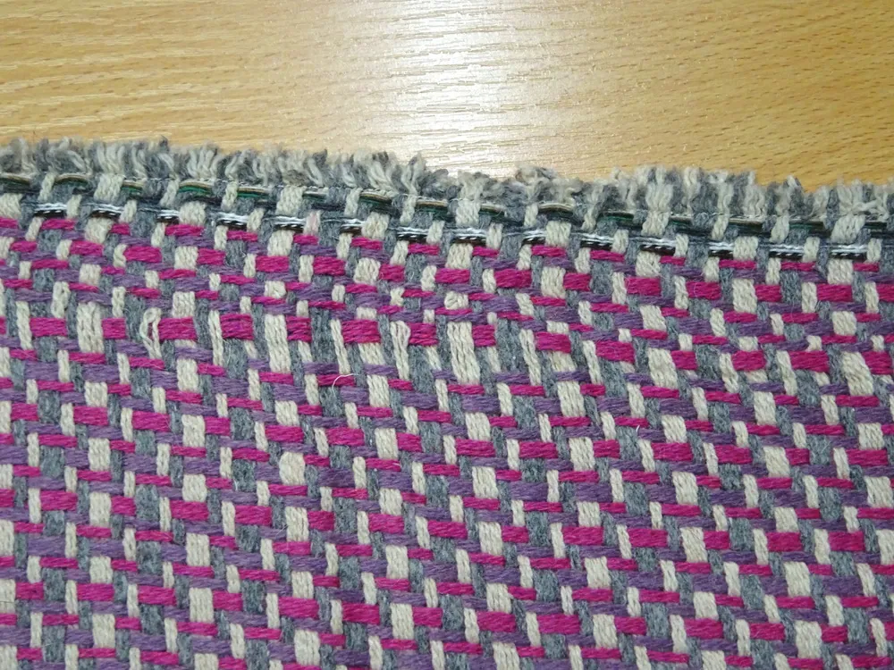 Kabátovina "cyklaménovo-fialovo-sivo-béžová" 